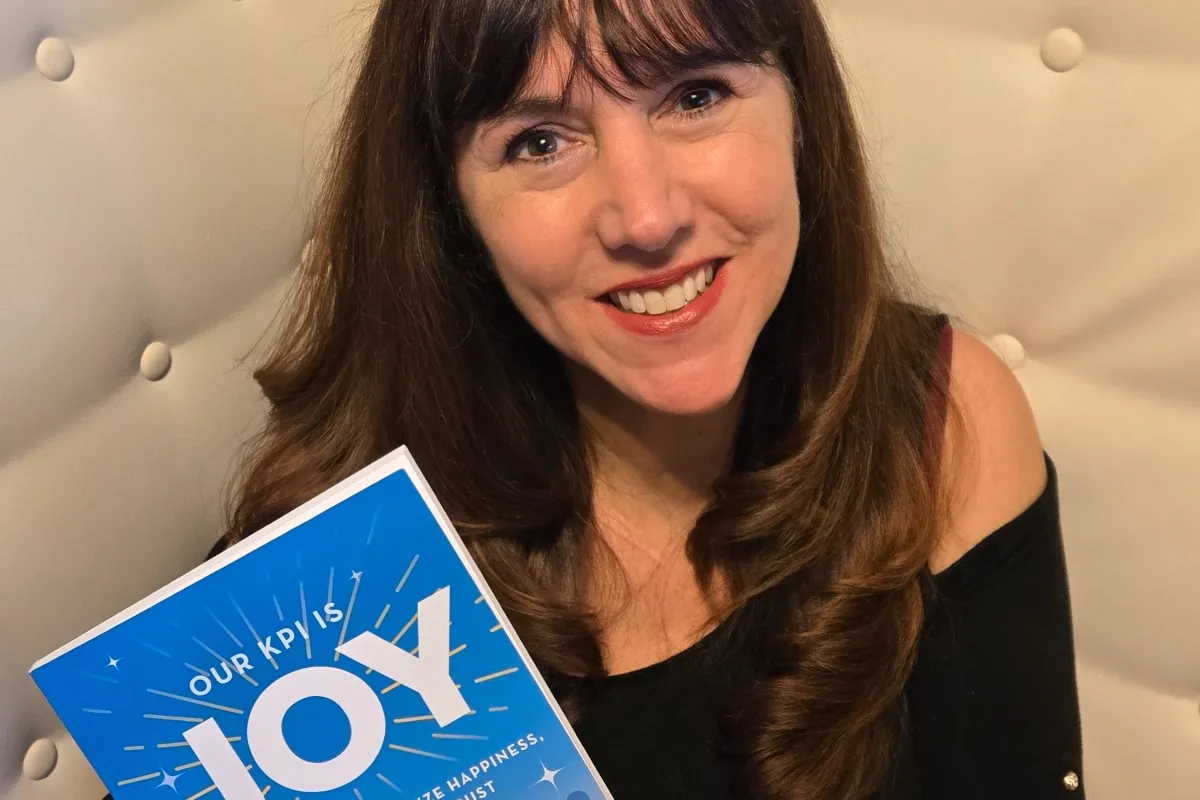 Tahira Endean is holding her book Our KPI is Joy